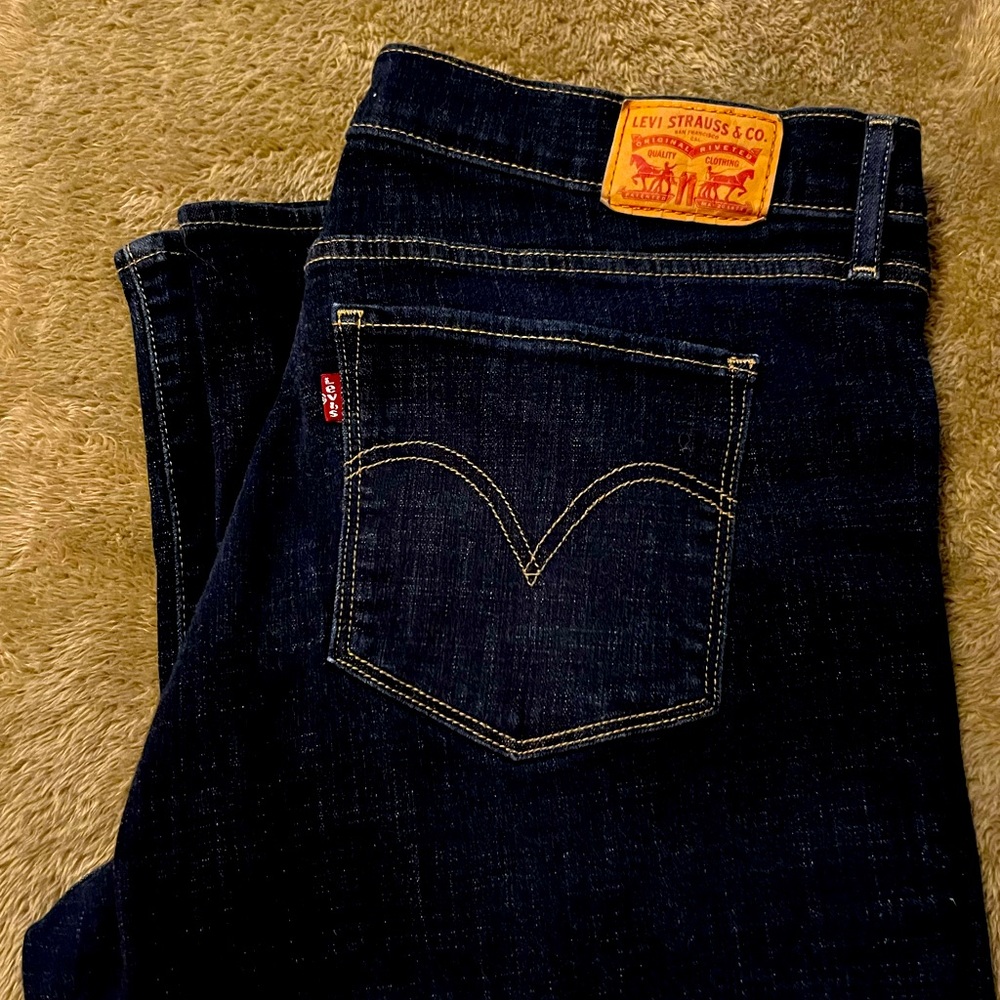 Dark wash Levi jeans.